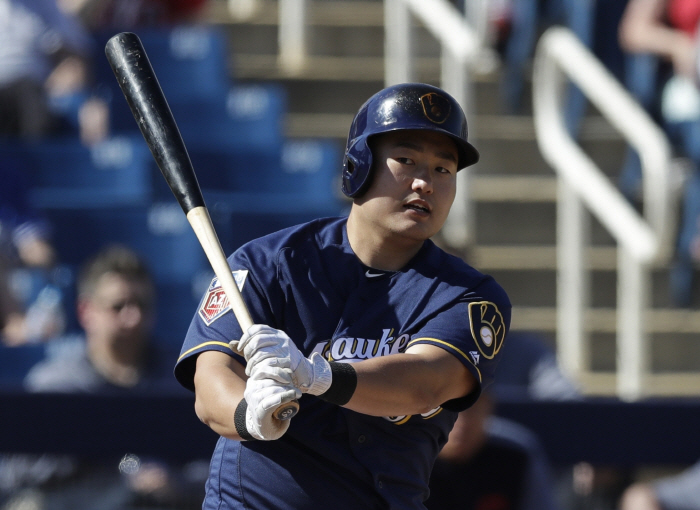 In this Feb. 26, 2018, file photo,<br />
Milwaukee Brewers` Ji-Man Choi (AP Photo/Carlos Osorio, File)<br />
...