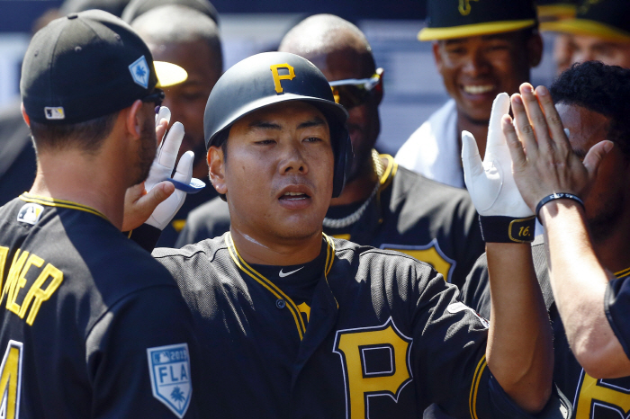 Mar 10, 2019; Tampa, FL, USA; Pittsburgh Pirates third baseman Jung Ho Kang (16) celebrates with tea...