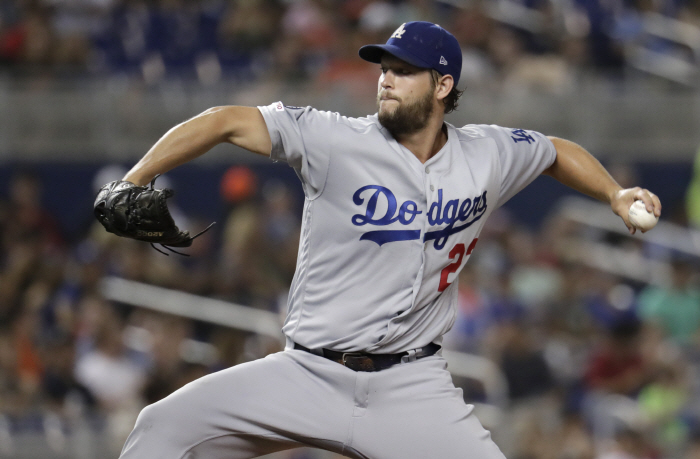 Los Angeles Dodgers starting pitcher Clayton Kershaw throws during the fourth inning of the team's b...